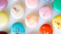 The top view of various macarons in different colors