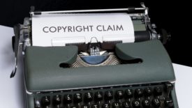 a piece of paper in a typewriter that says, "copyright claim"