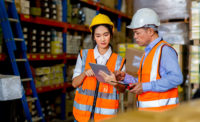 warehouse-worker-standing-by-storage-rack