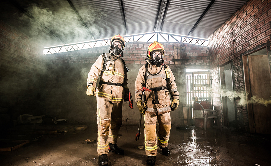 Firemen at dry process facility fire