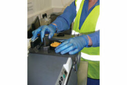 man in gloves measuring food manufacturing