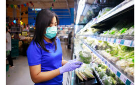 Woman mask shopping produce